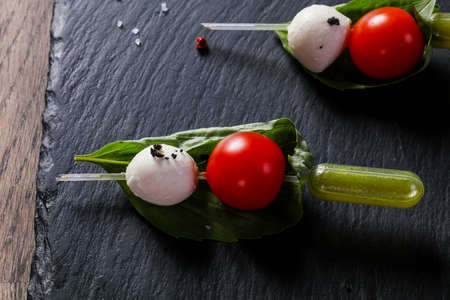 Canape caprese with olive oilの写真素材