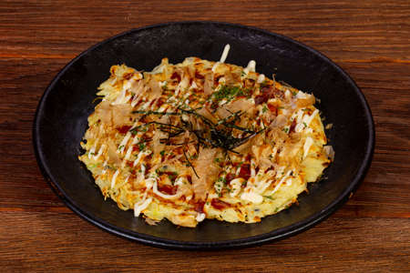 Japanese pizza with seafood and fishの写真素材