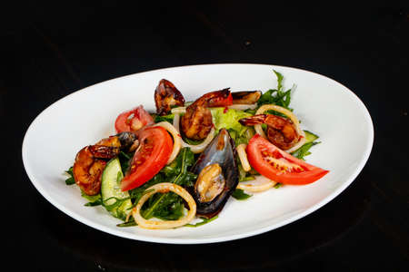 Salad with seafood and rucolaの写真素材