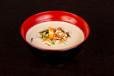 Cream asian soup with fishの写真素材