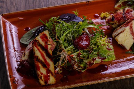 Grilled cheese with sauce and saladの写真素材