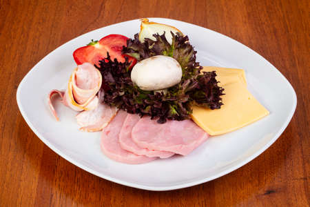 Appetizing omlete additives with cheese, ham, bacon, mushrooms and tomatoesの写真素材