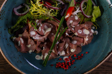 Beef salad with sauce and onion