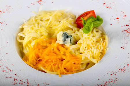 Pasta four cheeses served basilの写真素材
