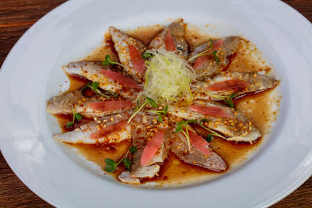 Carpaccio with dorada fish and sauce