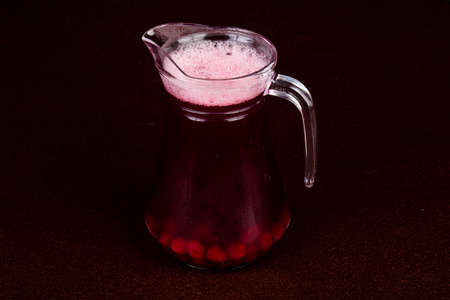 Cherry compote in the glass with berriesの写真素材