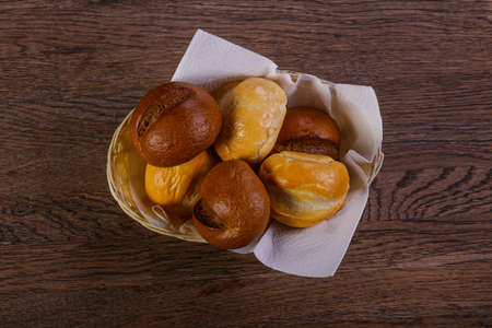 Fresh baked buns over the woodenの写真素材