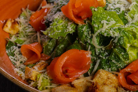 Caesar salad with salmon and parmesan cheeseの写真素材