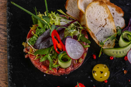 Raw beef tartar served quail eggの写真素材