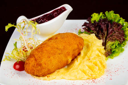 Chicken Kiev cutlet with mashed potatoの写真素材