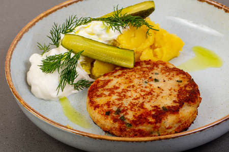 Cutlet with pike fish and pickled cucumbers