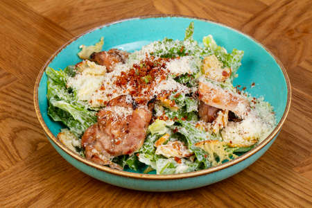 Caesar salad with chicken and parmesan cheeseの写真素材