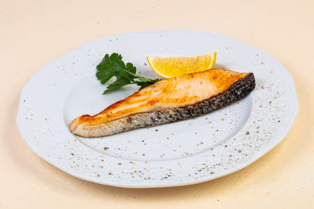 Roasted salmon steak with lemon