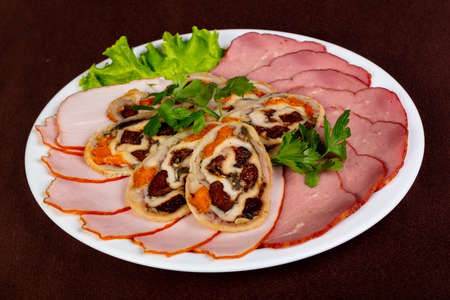 Sausages plate mix over the wooden backgroundの写真素材