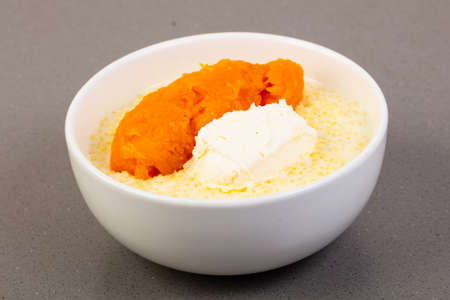 Porridge with pumpkin in the bowlの写真素材