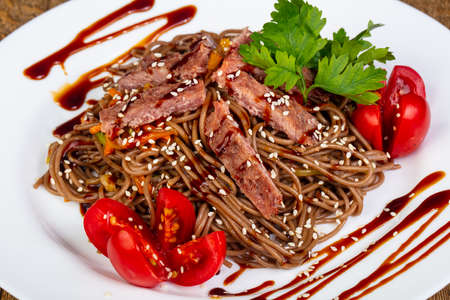 Wok Udon noodle with beefの写真素材