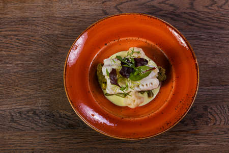 Steamed fith with salad leaves