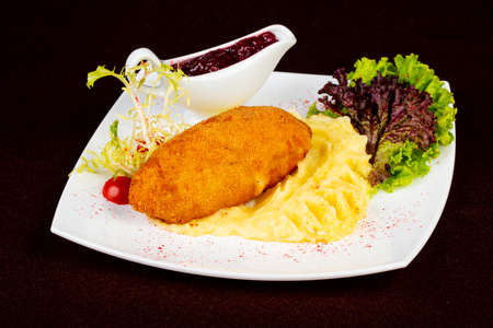 Chicken Kiev cutlet with mashed potatoの写真素材