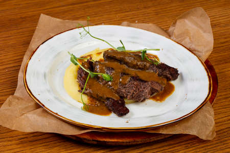 Roasted beef with gravy and mashed potatoの写真素材