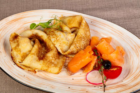 Russian tasty pancakes with salmonの写真素材