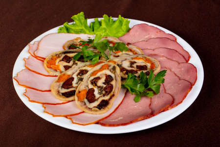 Sausages plate mix over the wooden backgroundの写真素材