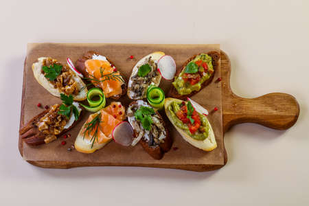 Spanish bruschetta mix with fish and vegetables