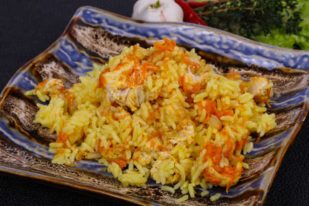Traditional Pilaf with chicken and carrot served garlic and thymeの写真素材