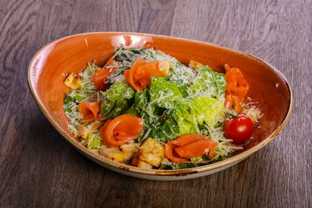 Caesar salad with salmon and parmesan cheeseの写真素材