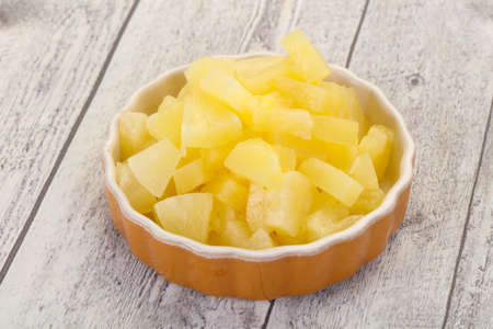 Marinated pineapple pieces in the bowlの写真素材