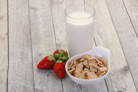 Wheat flakes for breakfast with milk and strawberry