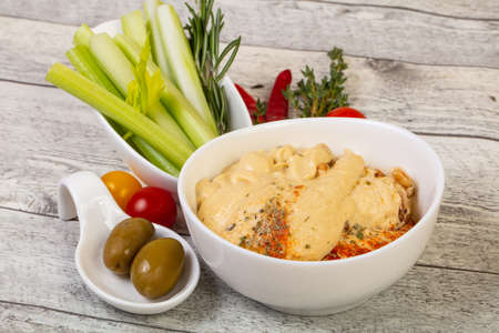 Vegan cuisine - Humus with celery sticksの写真素材