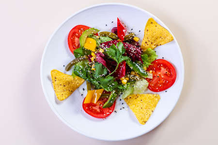 Vegetables salad with avocado and cornの写真素材