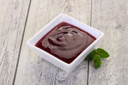 Delicous cowberry sauce with mint leavesの写真素材