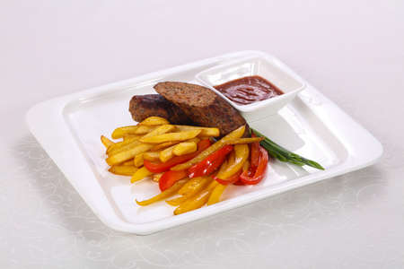 Roasted sausage with fried potato and vegetables