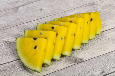Sliced sweet tasty yellow ripe watermelonの写真素材