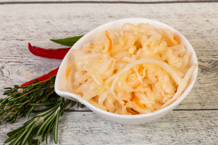 Pickled cabbage - sauerkraut with thyme and rosemaryの写真素材