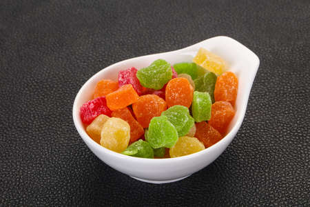 Sweet candied fruit heap in the bowlの写真素材