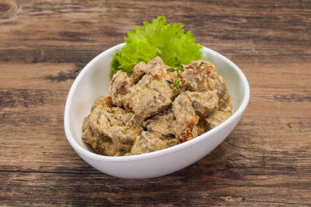 Chicken liver with cream and dry tomatoes served thymeの写真素材