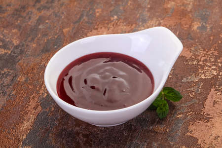Delicious cowberry sauce with mint leavesの写真素材