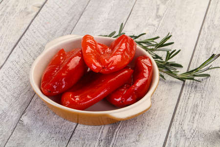 Pickled red bell pepper with oilの写真素材