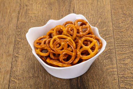 Salted tasty pretzel heap in the bowlの写真素材