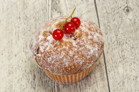 Sweet tasty muffin with red currants berriesの写真素材
