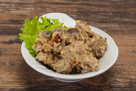 Chicken liver with cream and dry tomatoes served thymeの写真素材