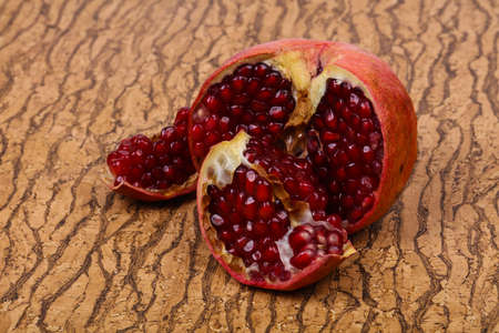 Ripe tasty sweet pomegranate fruitの写真素材