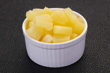 Marinated pineapple pieces in the bowlの写真素材