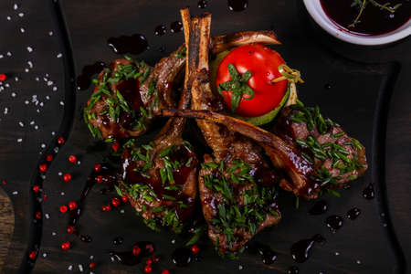 Roasted lamb ribs with sauceの写真素材