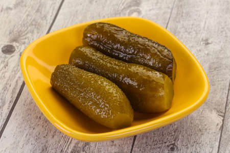 Pickled homemade cucumbers in the bowlの写真素材