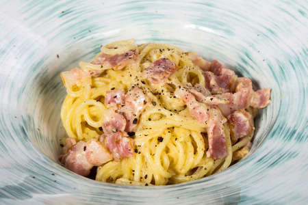 Pasta Carbonara with ham and parmesanの写真素材