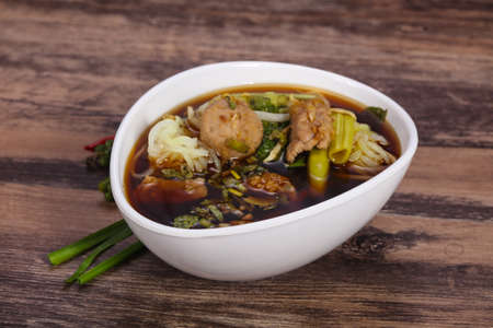 Thai style soup with meat, vegetables and mushroomsの写真素材