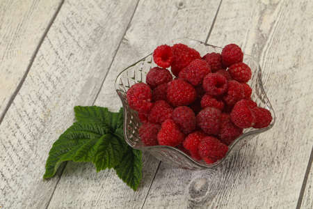 Red bright ripe sweet raspberry with leaf